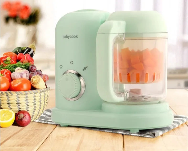 Baby food processor with steamer and blender functions in green colour with dual mixing blades