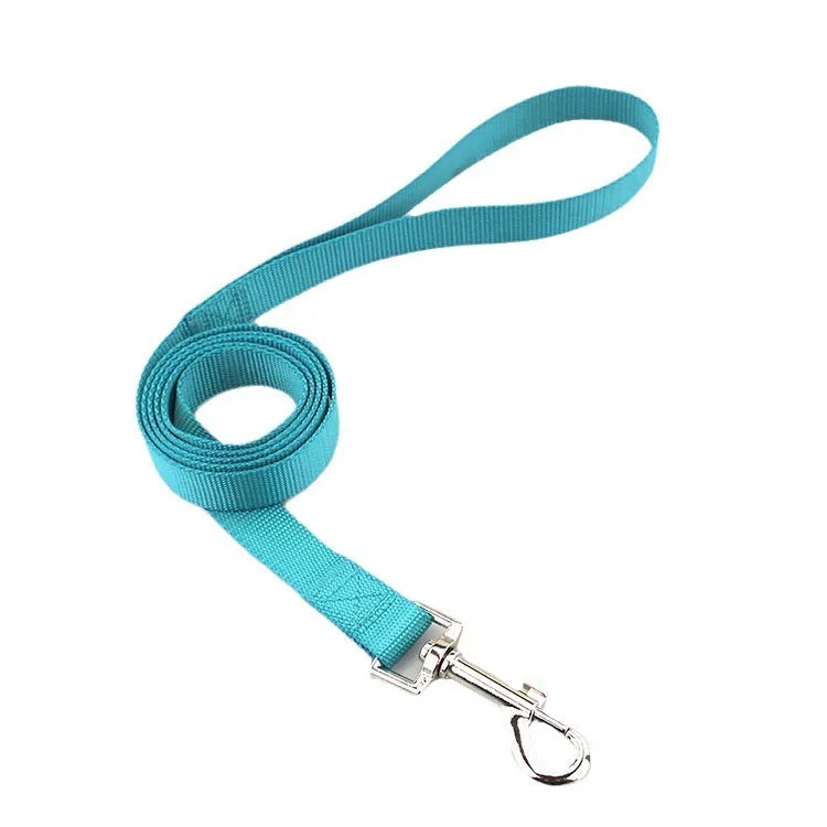 Solid colour nylon dog hand holding rope tug toy showing multiple colour options and size variations