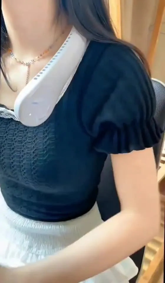 Pink bladeless neck-hanging personal fan with USB charging port.