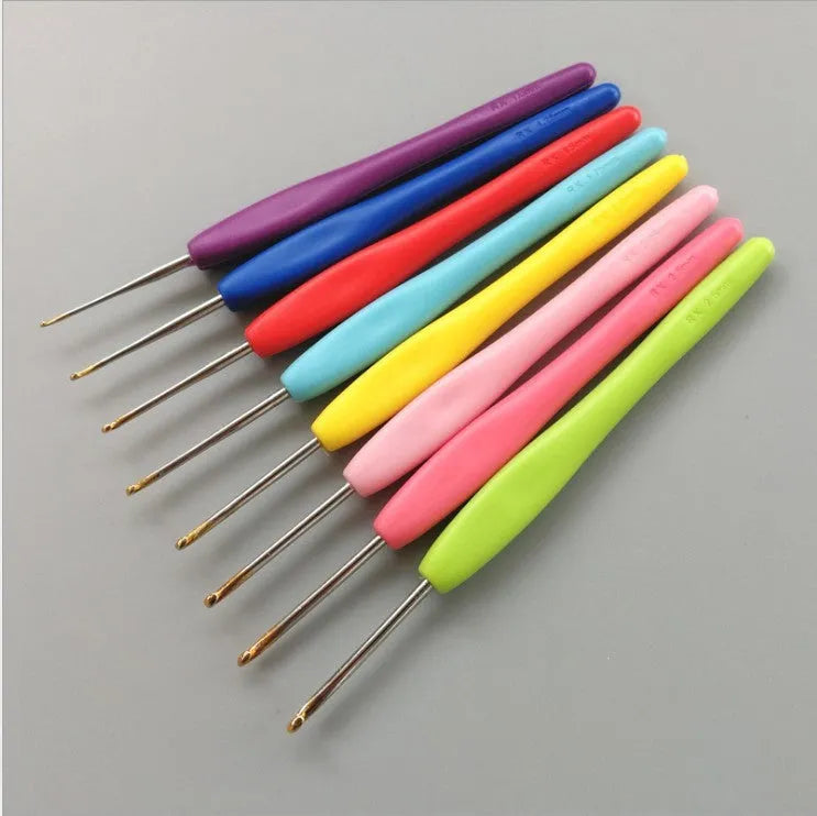 Set of 16 crochet hooks with different coloured handles in a grey PU storage bag