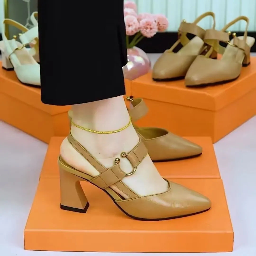 Women's black leather high-heeled sandals with a closed pointed toe and a chunky rubber heel.