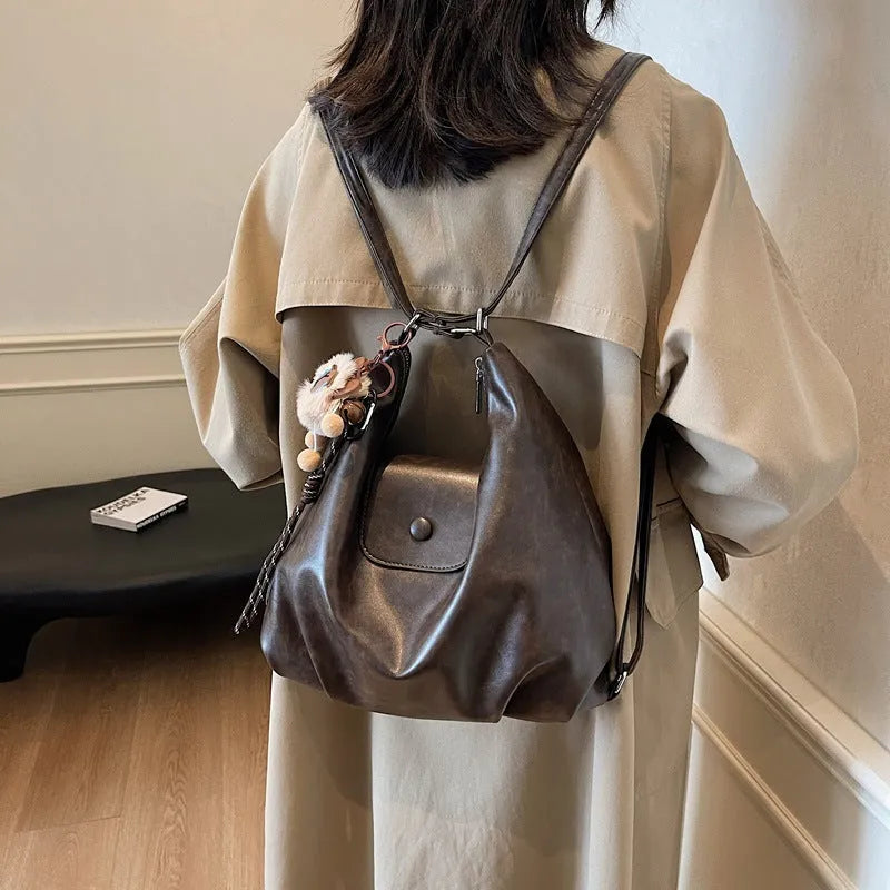 Large capacity textured PU commuter backpack with horizontal square shape and single shoulder strap