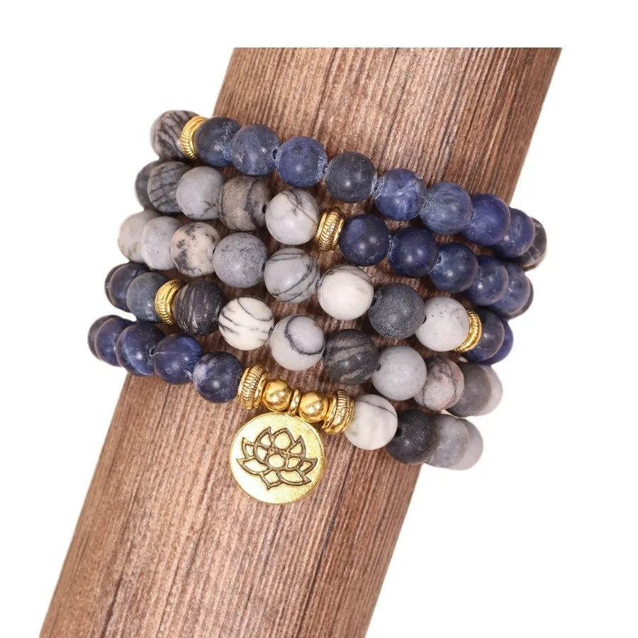 Multi-layer blue bracelet with patterned network stone beads on an alloy chain, natural style.