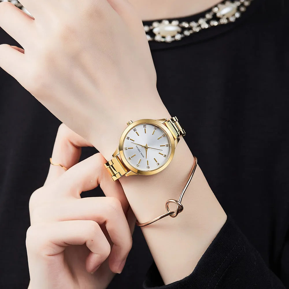 Women's 34mm solid steel strap quartz watch with rhinestone accents, blue dial, alloy case, 3ATM water-resistant