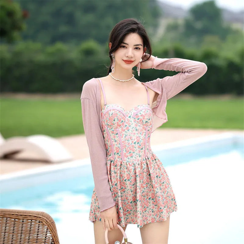 Women's floral pattern one-piece swimsuit with suspender straps in pink or green colour options