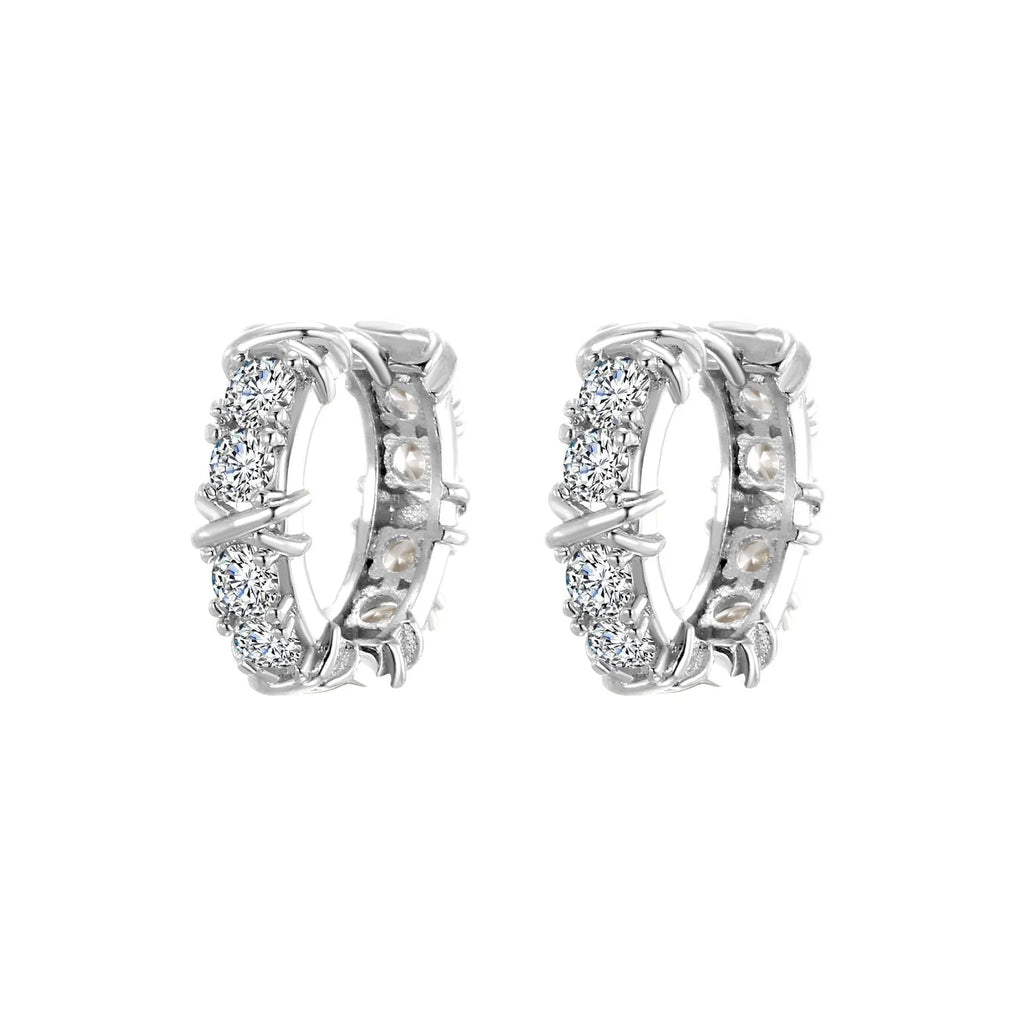A pair of women's hexagonal geometric earrings with a clover cross design in silver or gold colour.