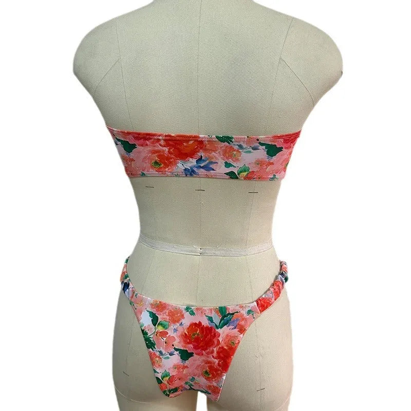 Floral printed lace bikini top in blue, shown as a sleeveless, backless tube top for swimming.