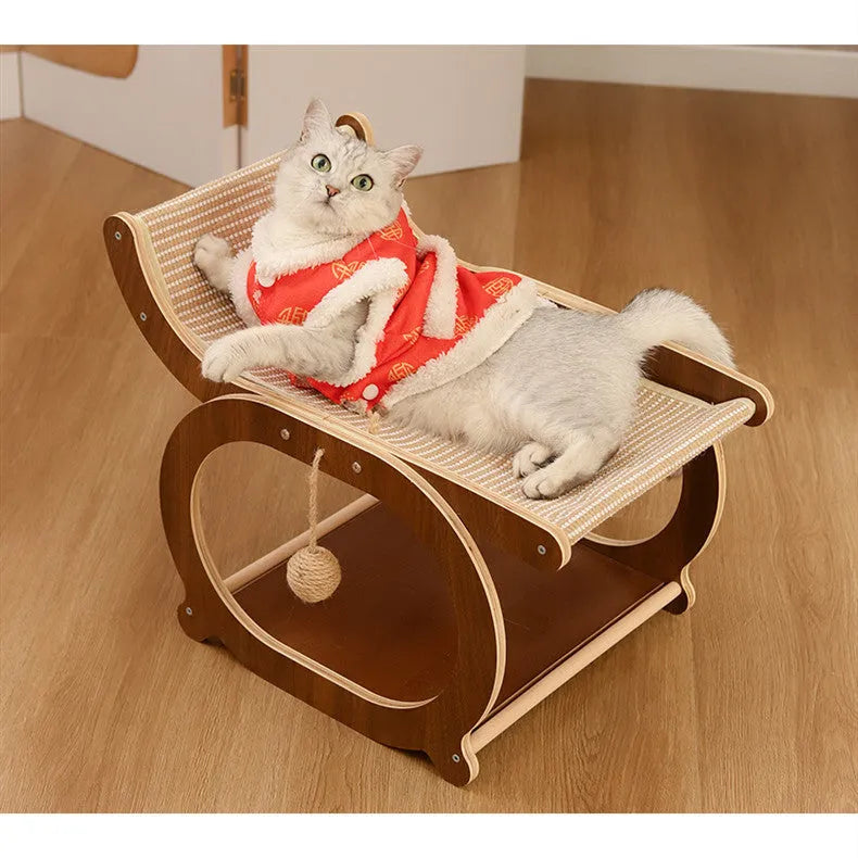 Solid wood frame sisal scratching mat serving as a raised cat bed in a walnut wood finish.