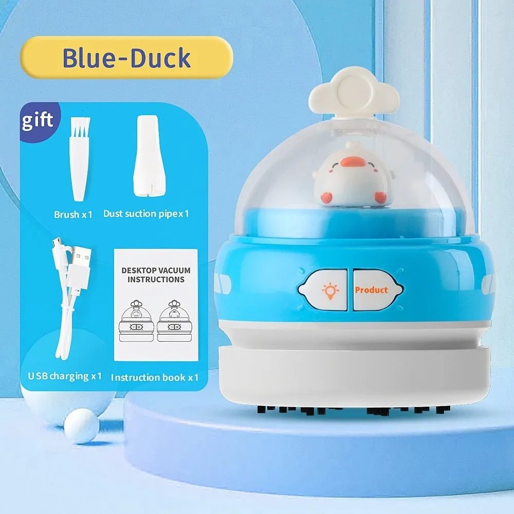 USB-powered handheld desktop vacuum cleaner in blue rocket design on a wooden desk.