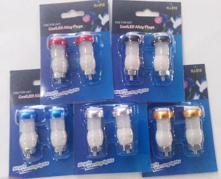 Aluminium alloy bicycle handlebar end lights in anodised colours with red LED illumination