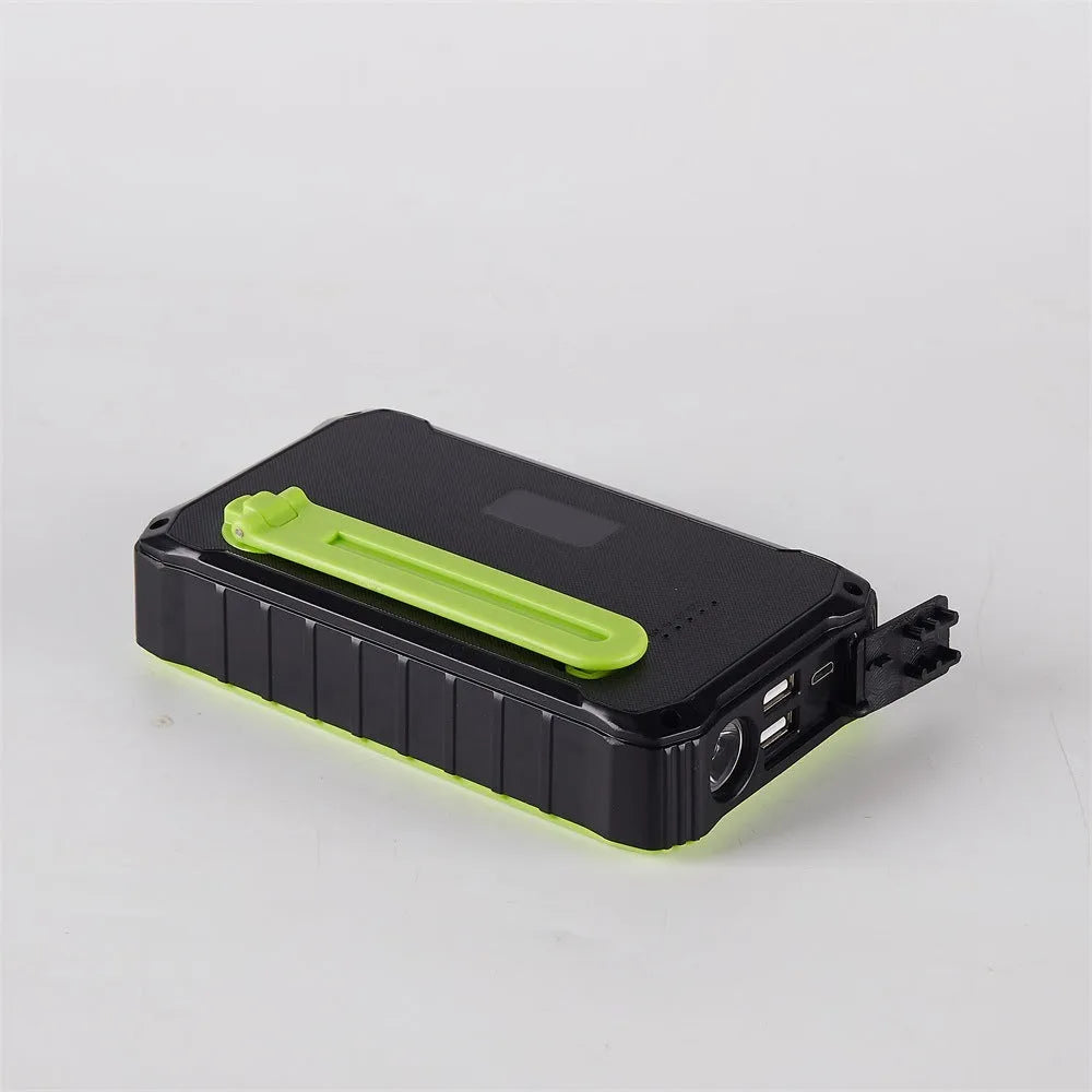 Green and orange hand crank solar power bank with unfolded solar panel and dual USB ports