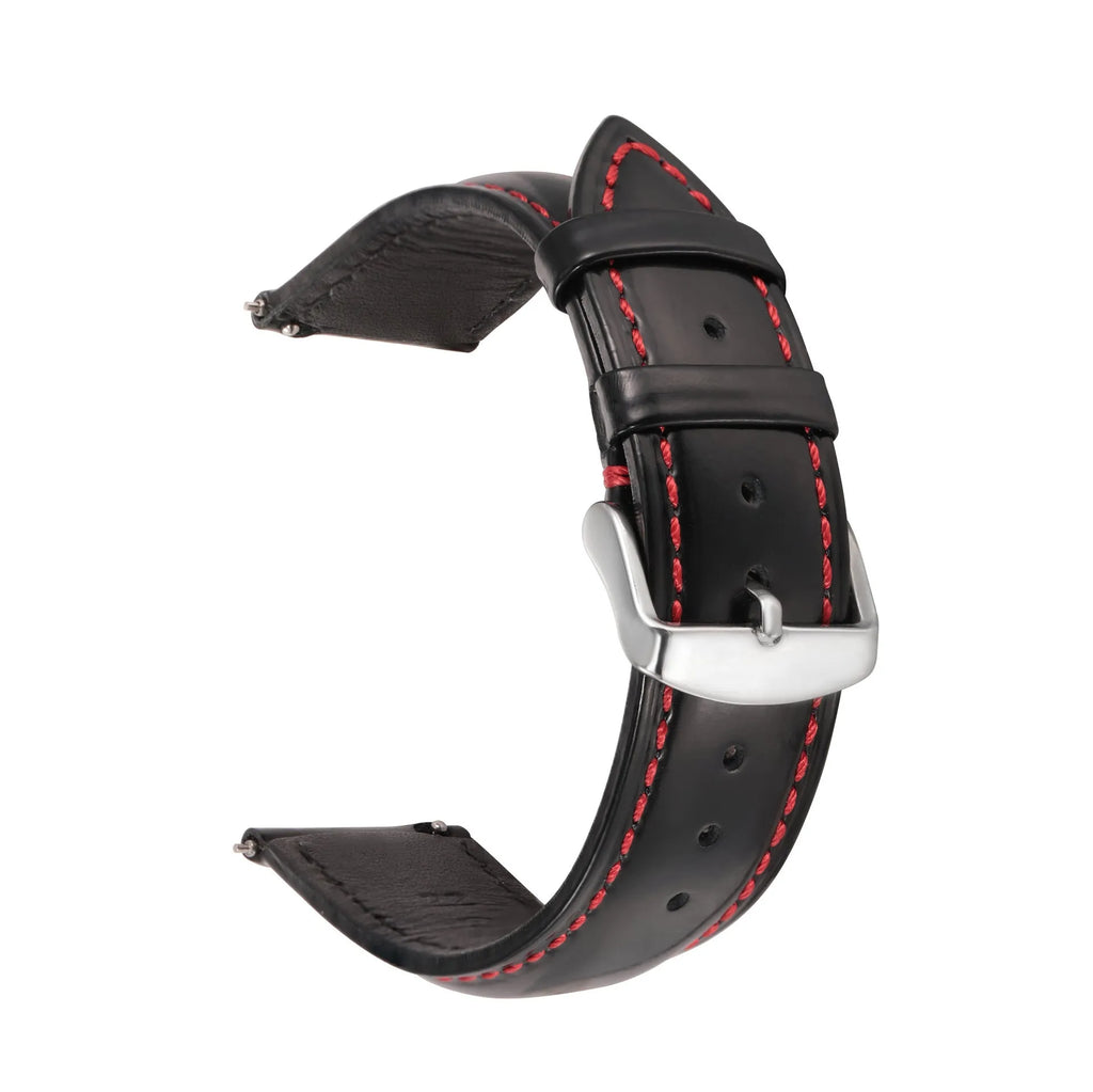 Quick release watch strap in black cowhide leather with white contrast stitching, shown detached from a watch.