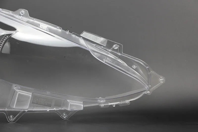 Mazda 3 Exela replacement headlamp cover with snake glue adhesive tube.