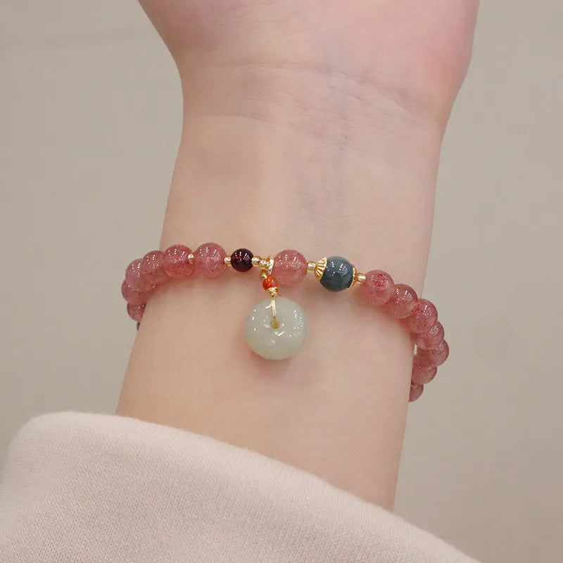 Strawberry quartz bracelet with geometric shapes, purse charm, and safety buckle closure