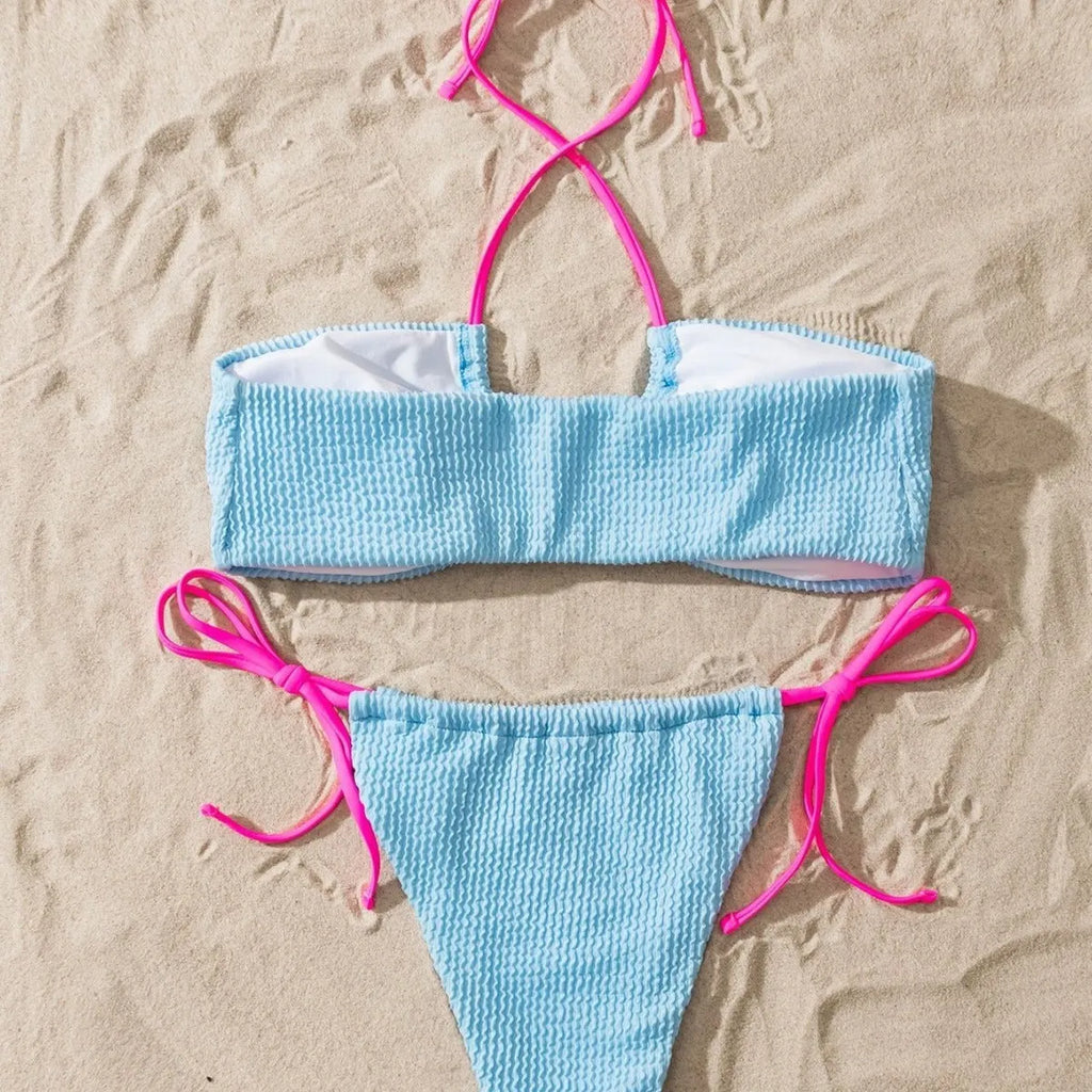 Women's solid colour separated swimsuit with halter neck and lace-up front, briefs style