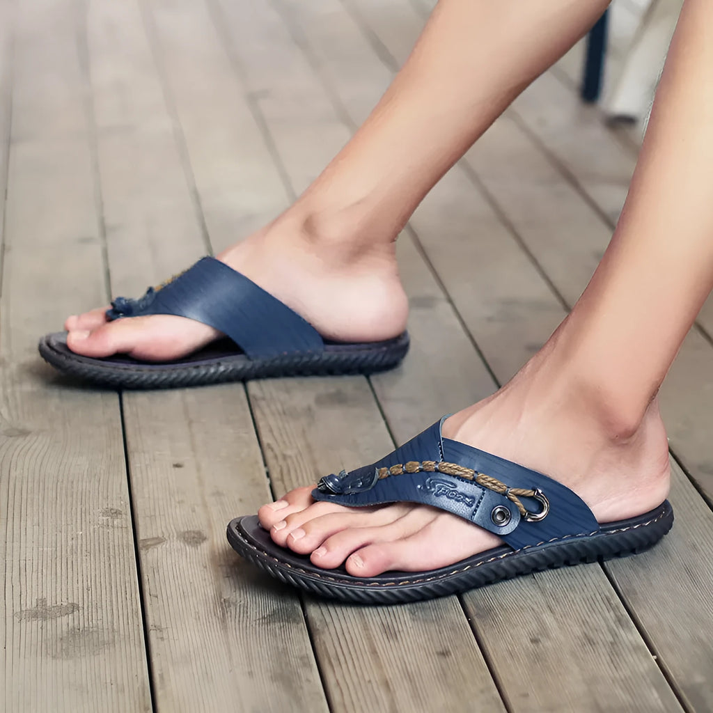 Men's non-slip casual slippers in black PU leather, showing sole tread and lightweight design.