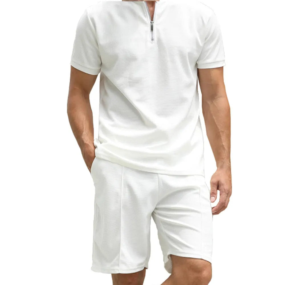 Men's solid colour short sleeve polo shirt and matching trousers two-piece set.