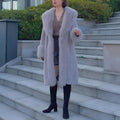 Women's thick grey faux rabbit fur mid-length coat with a collar on a hanger