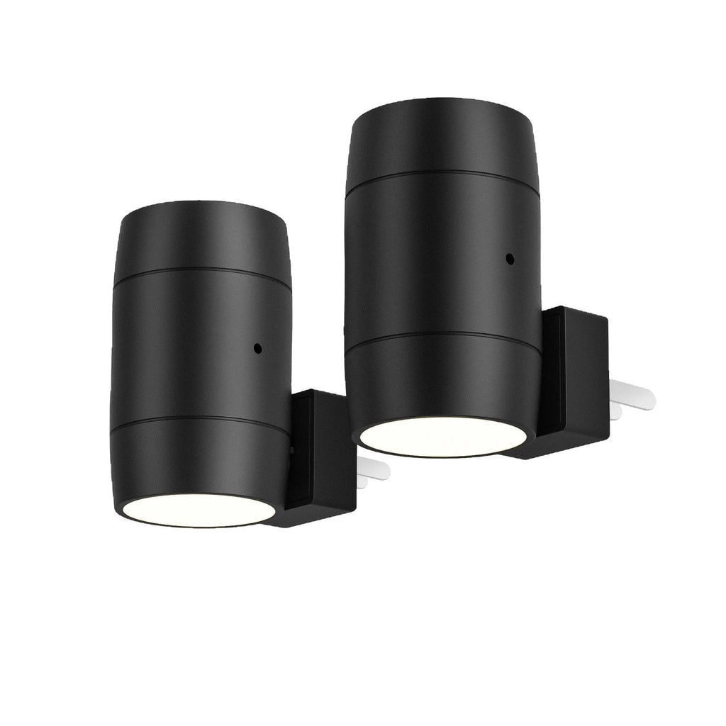 Small white plug-in induction night lamp with a rotatable head on a dark background.