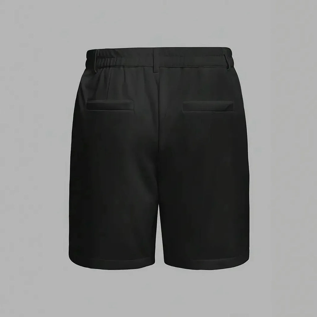 Man wearing grey straight-leg casual cotton blend sports shorts on a neutral background.