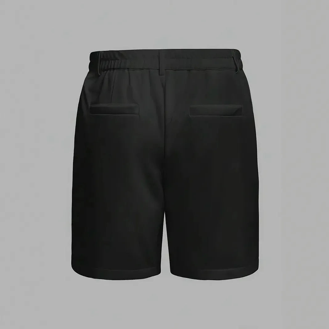 Man wearing grey straight-leg casual cotton blend sports shorts on a neutral background.