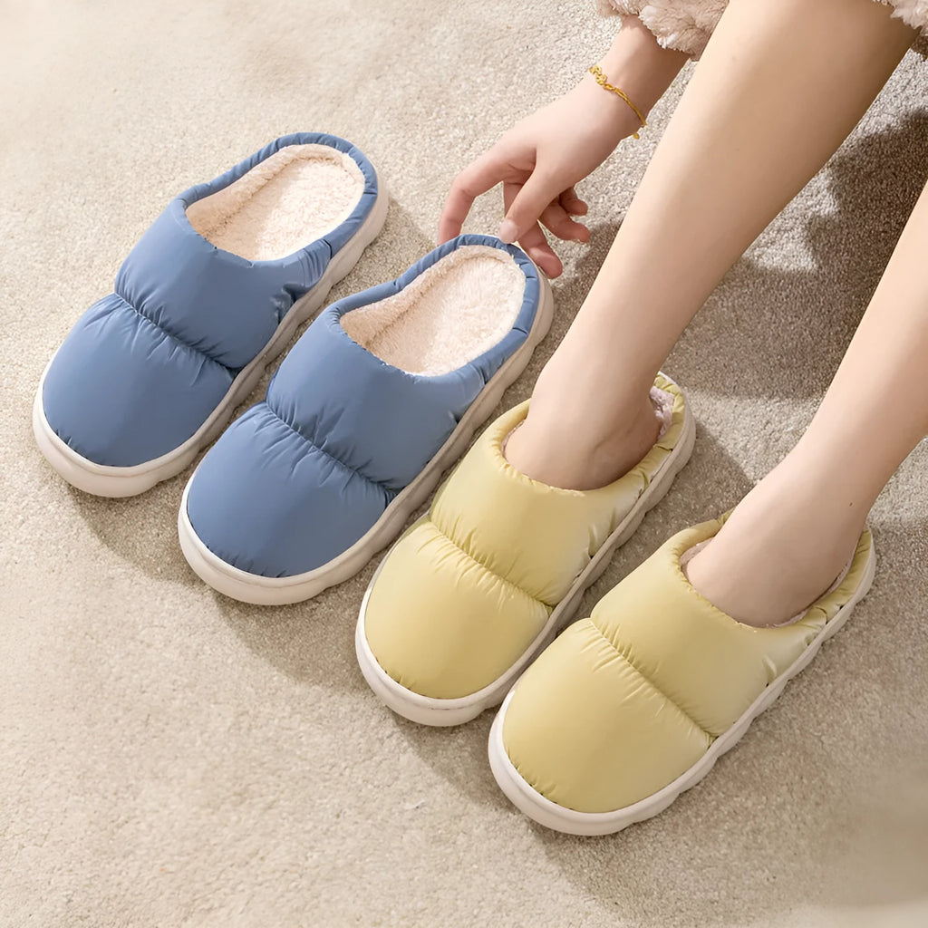 Pair of down cotton slippers with artificial leather upper and thick rubber sole, shown in available colours.