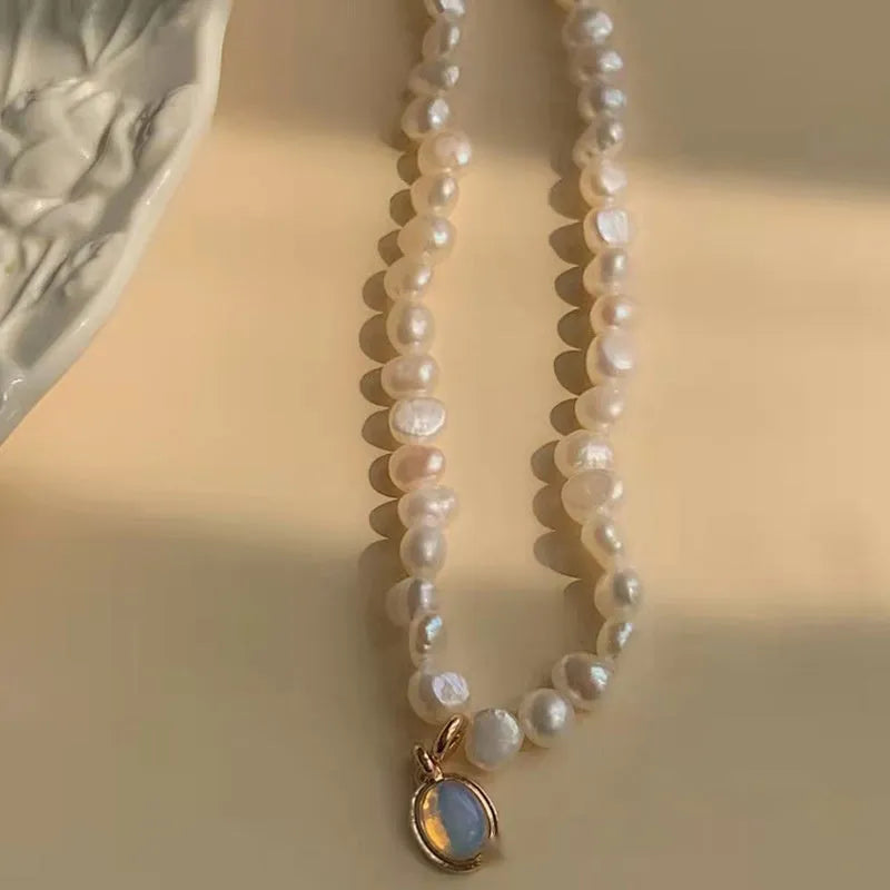 French Court style vintage pearl necklace with geometric alloy pendant on an adjustable chain.
