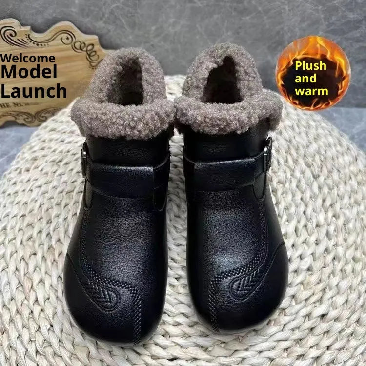 Women's winter slip-on ankle boots with round toe, low platform heel, in black synthetic leather with stitching detail