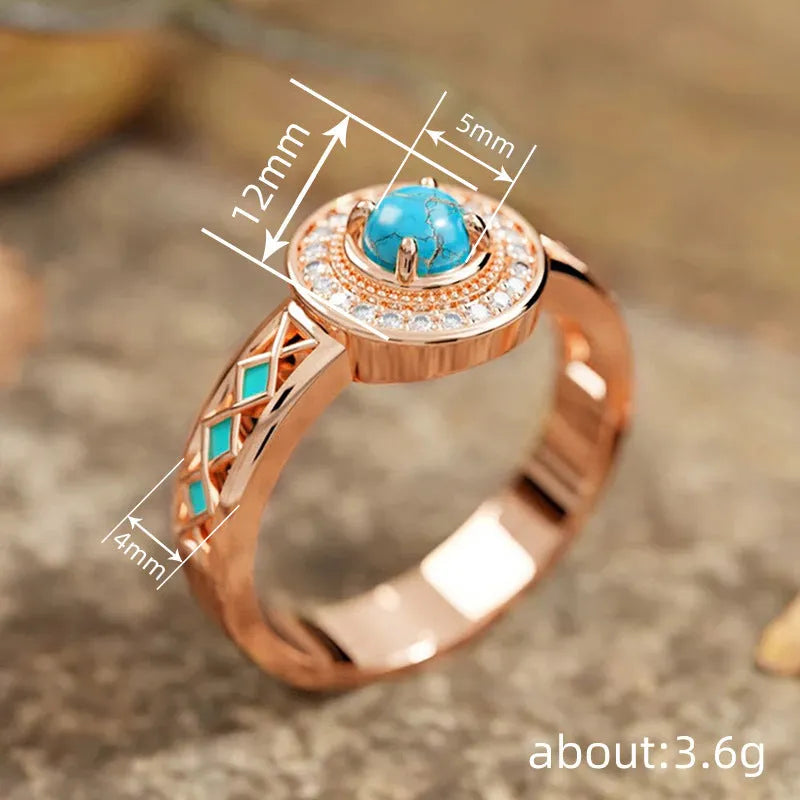 Women's turquoise ethnic geometric ring with micro inlaid zircon in rose gold coloured copper on a white background.