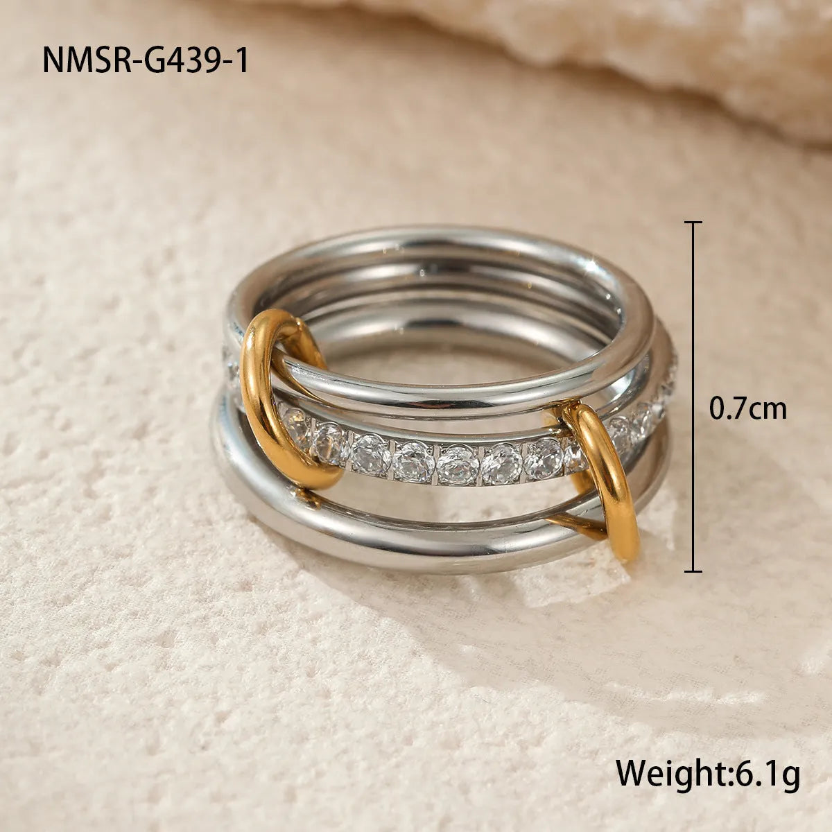 Stacked gold plated stainless steel rings with an exaggerated wide band design, shown in a free size.