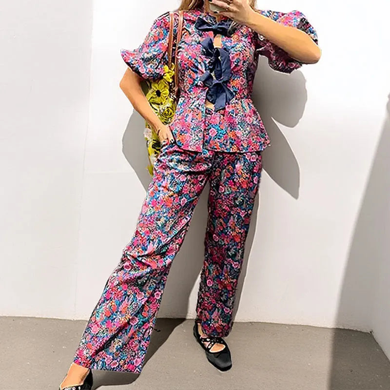 Women's floral print tie-neck long sleeve top with puff sleeves and matching trousers suit set