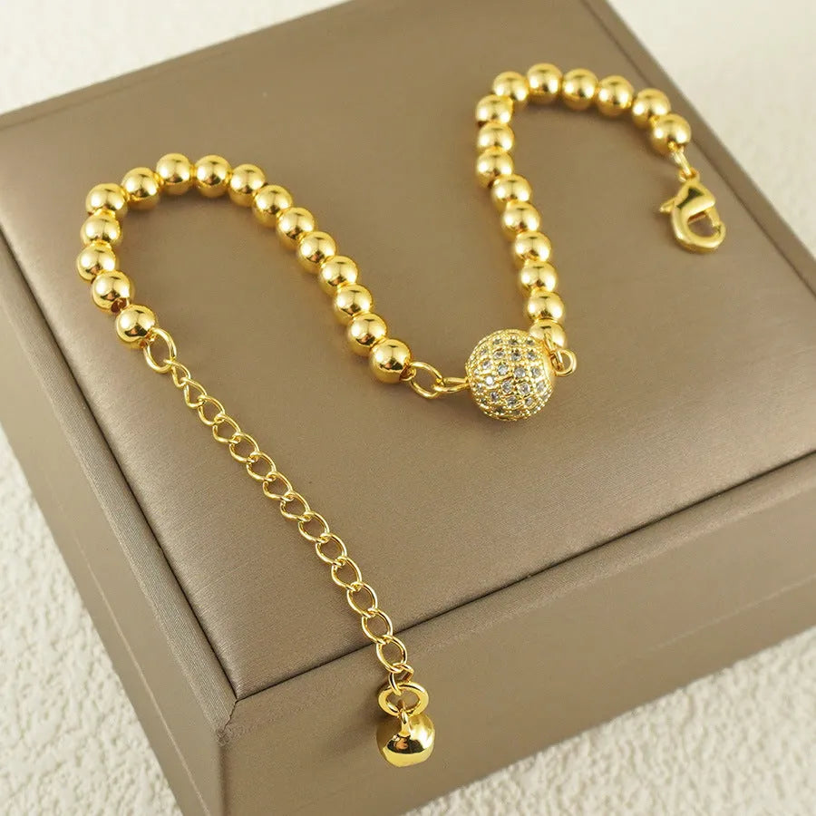 Women's Arabic-style copper bracelet with a heart shape and single zircon ball accent.