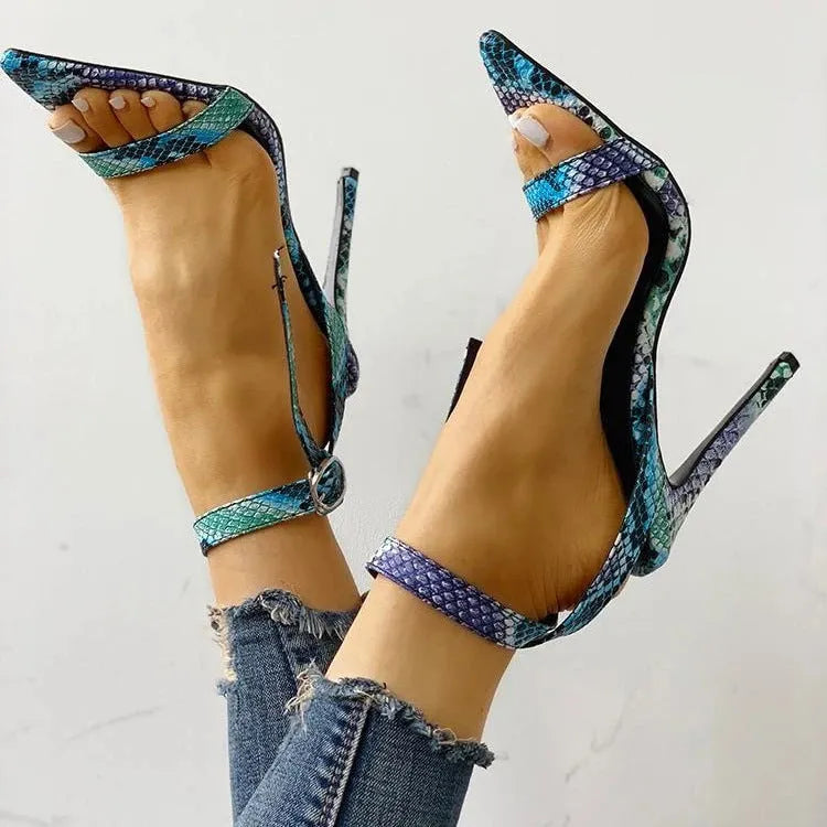 Blue women's high heels with hollow-out detail and a buckle strap on a pointed toe.