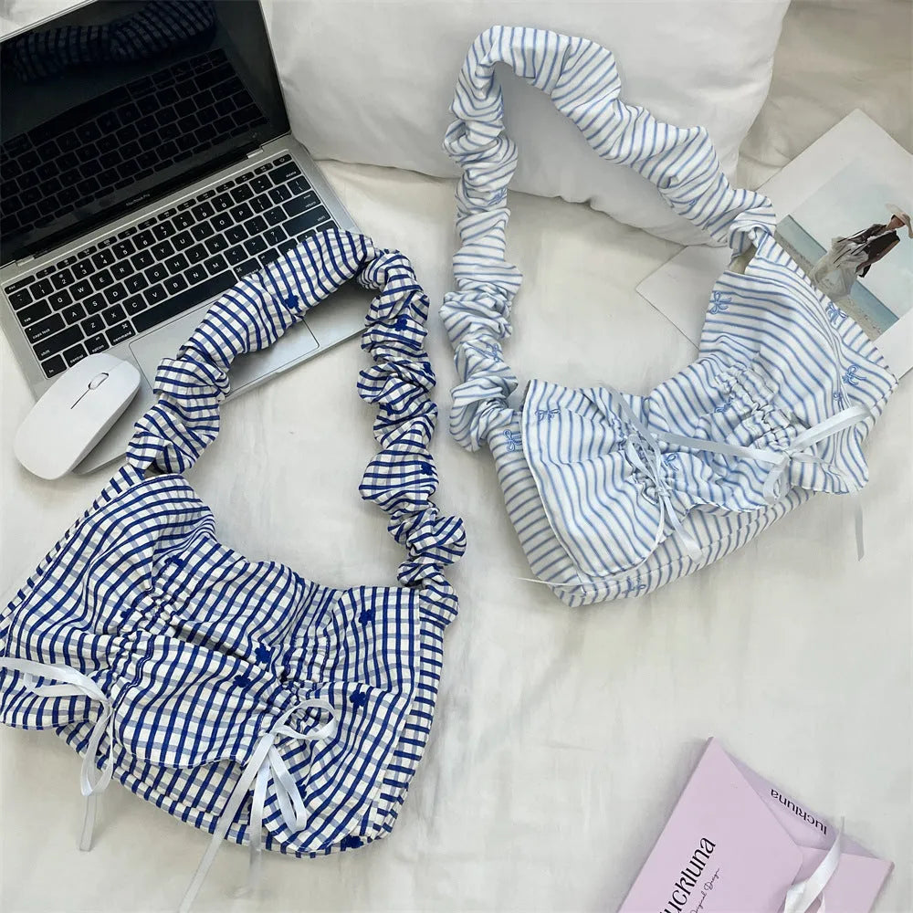 Women's soft polyester pleated flip shoulder bag with bow detail in blue plaid colour