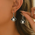 A pair of silver-colour retro fashion drop earrings for women with an electroplated finish.