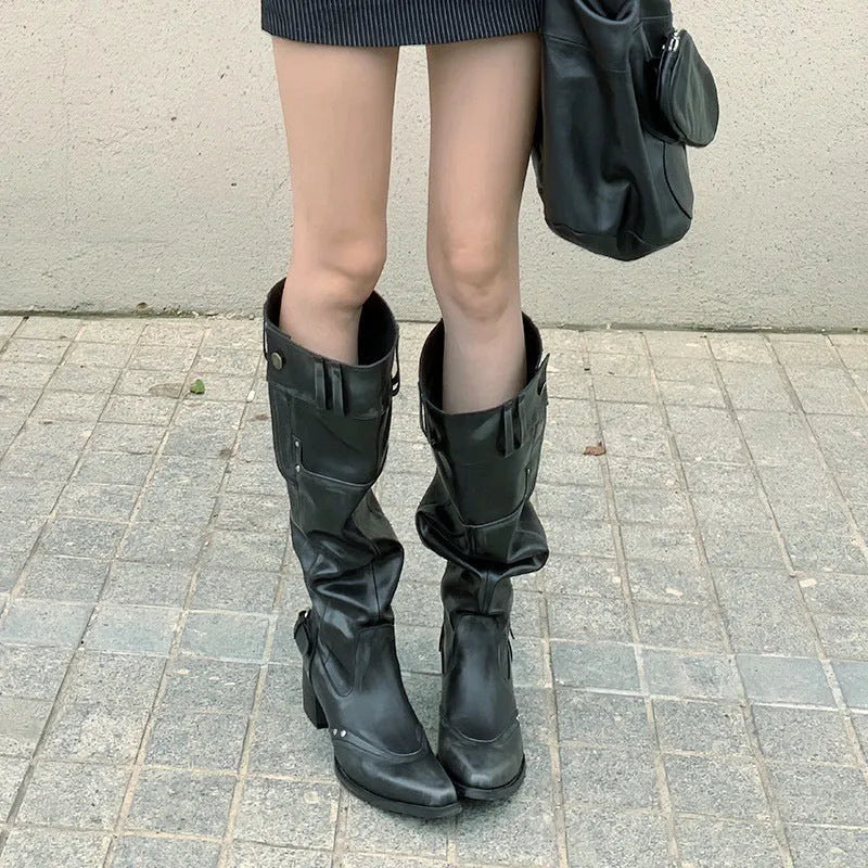 Black pointed toe chunky heel slimming boots with leather lining and high cylinder sock, side view on white background