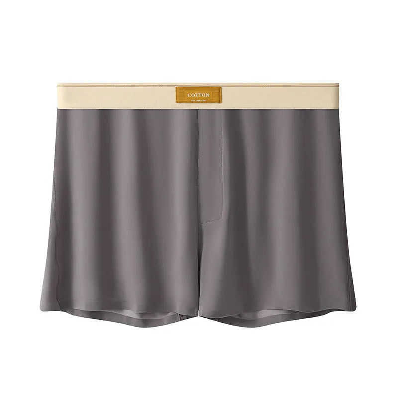 Pack of men's solid colour ice silk boxer shorts showing loose fit and mid-waist design.
