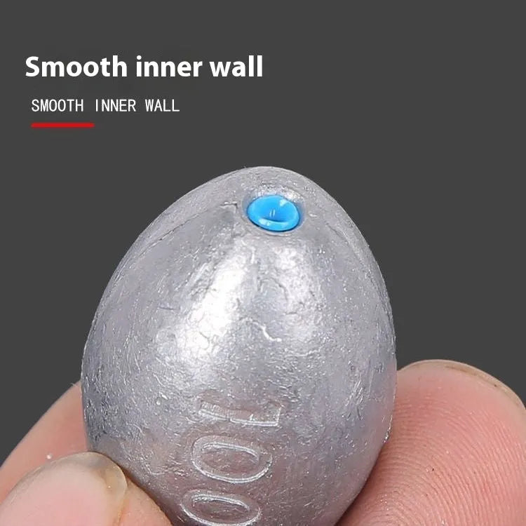 Tongxin olive lead fishing sinker with scale pattern in rugby shape, showing 10g to 150g weight options.
