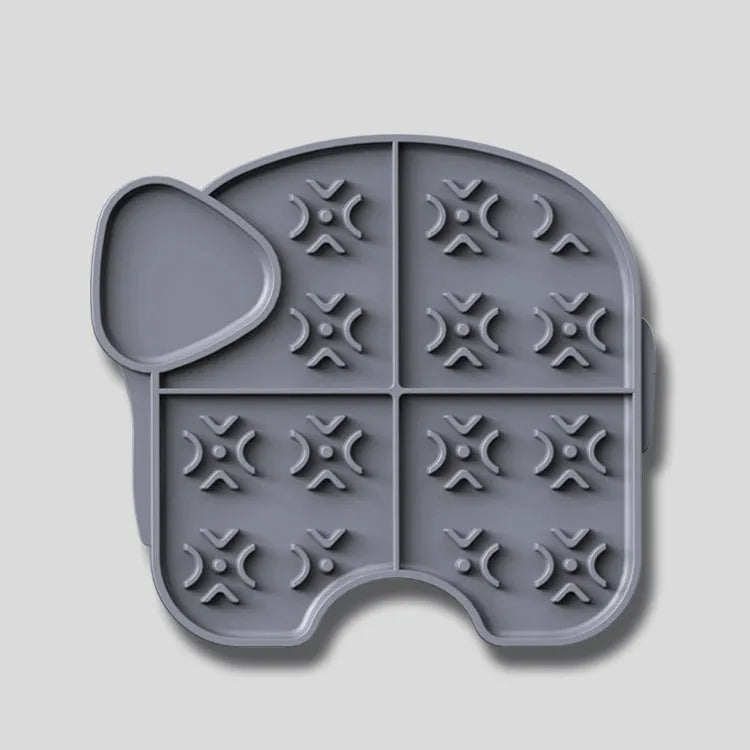Gray silicone pet slow food pad with suction cups under a pet bowl