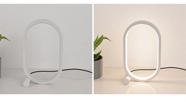 USB plug-in oval acrylic touch control night light with metal base, black finish, on a bedside table