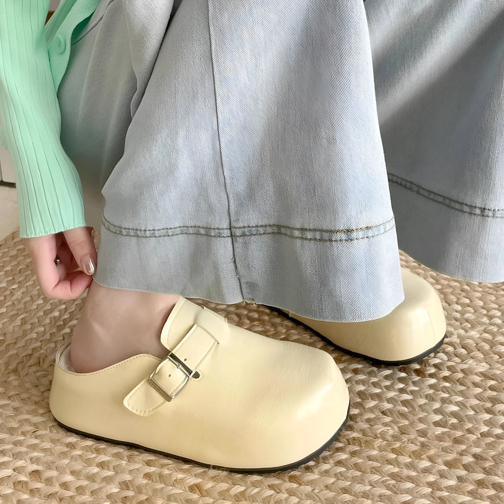 Flat buckle casual sneakers in yellow colour with round toe and PU upper material