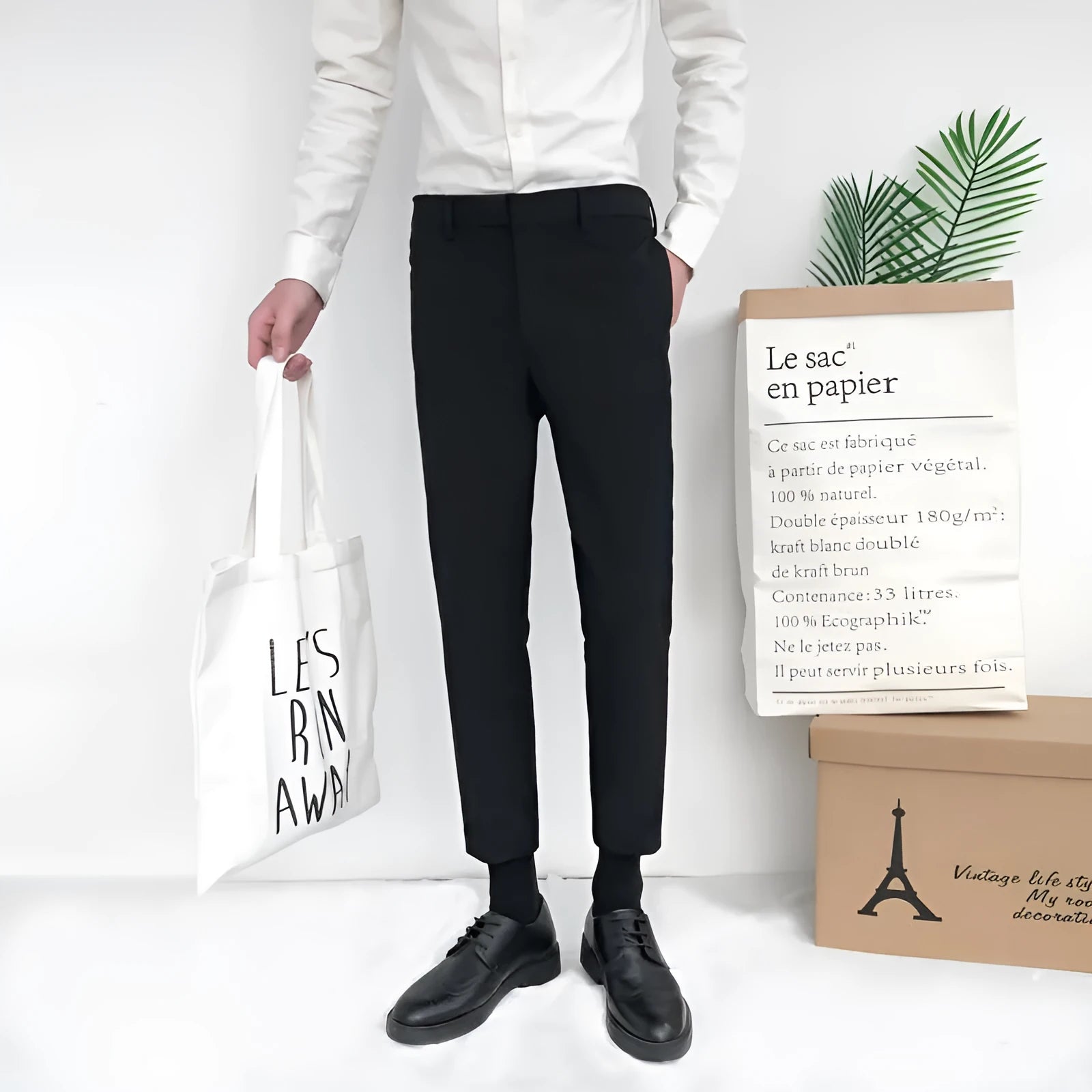 Men's slim straight-leg cotton trousers in black with a drawstring waist.