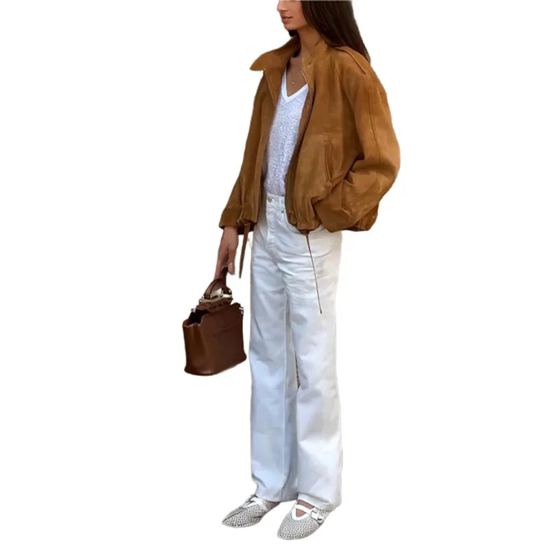 Retro solid colour loose fit polyester jacket on a hanger, showing long sleeves.