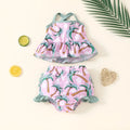 Girls' white two-piece swimsuit set with a top and shorts, made from polyester.