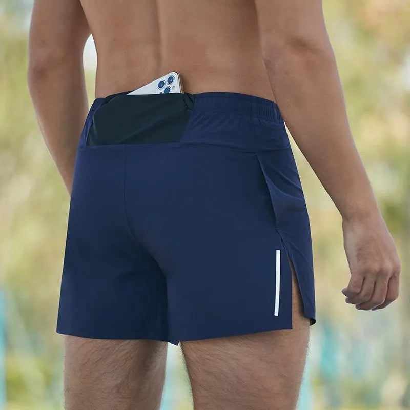Man's high-waist loose fit off-road running shorts in black, showing quick-dry fabric and inner lining detail.