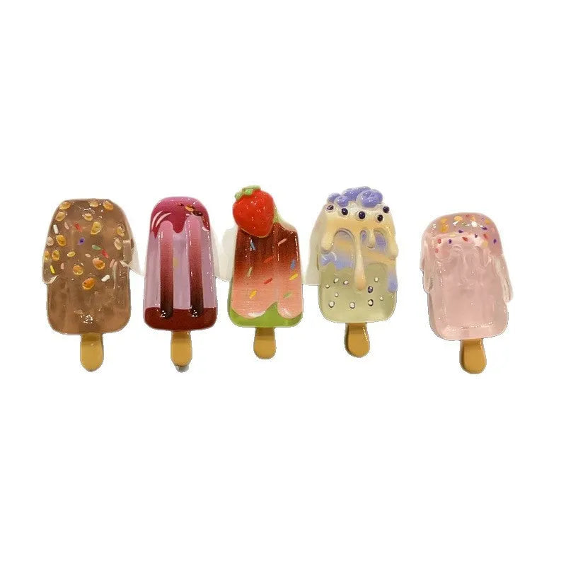 Cartoon ice cream design resin hair barrette clip in side view showing colour options.