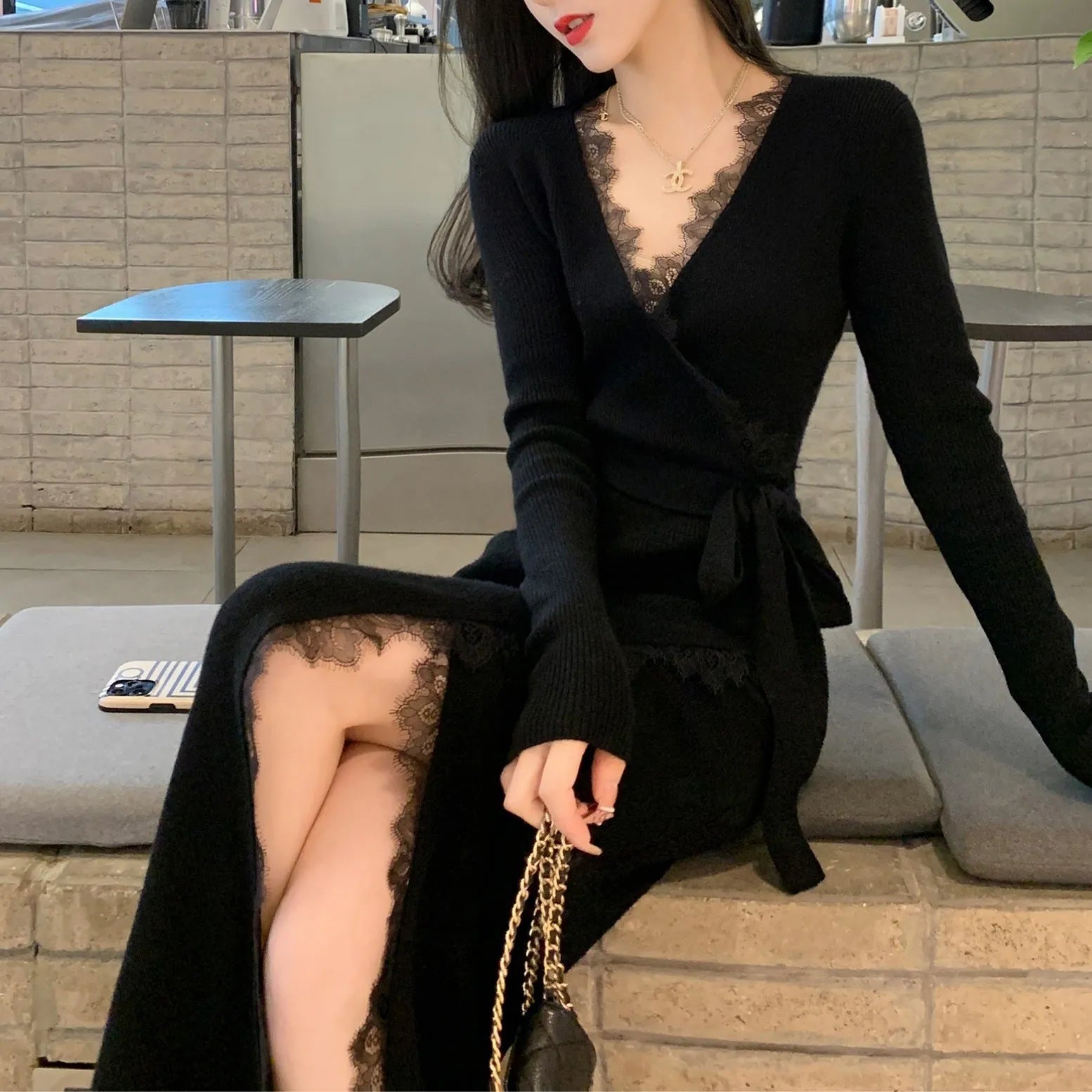 Women's solid black slim fit wool princess dress skirt on a hanger.
