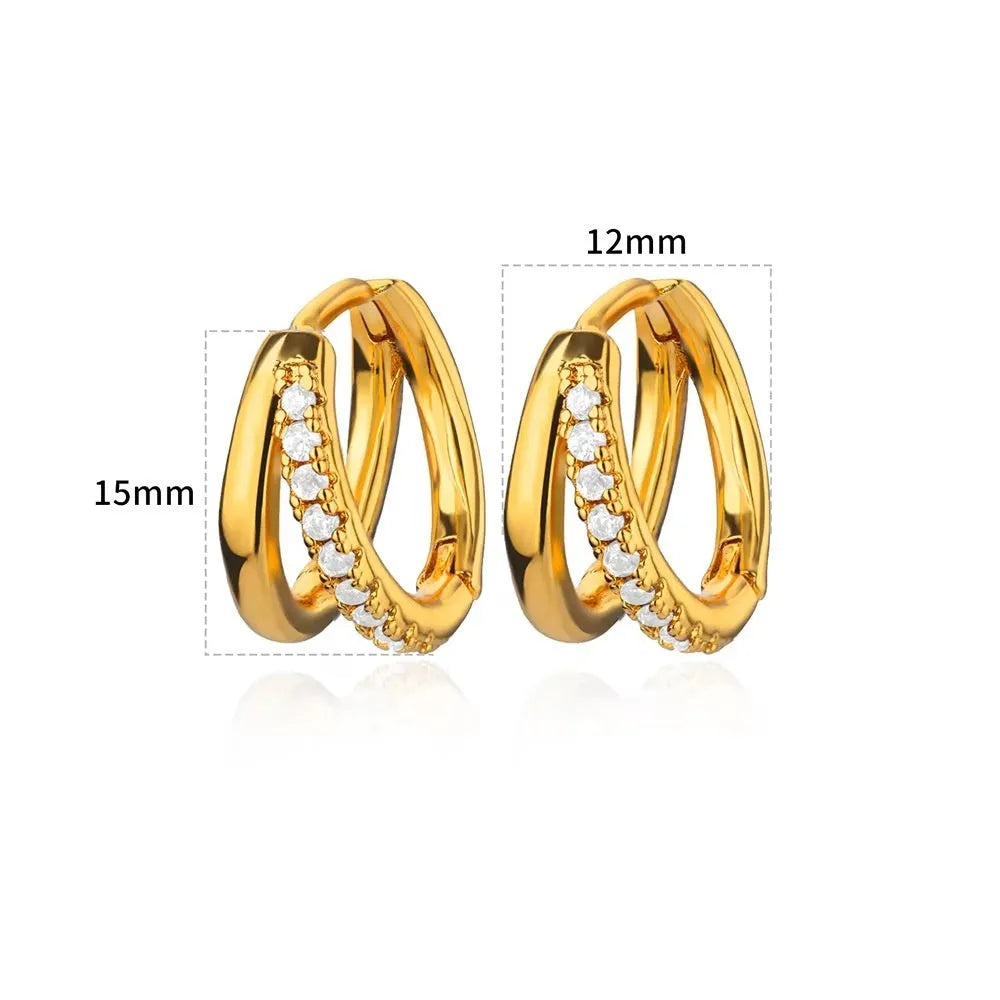 Women's geometric butterfly-shaped copper earrings with heart and star details in various colours.