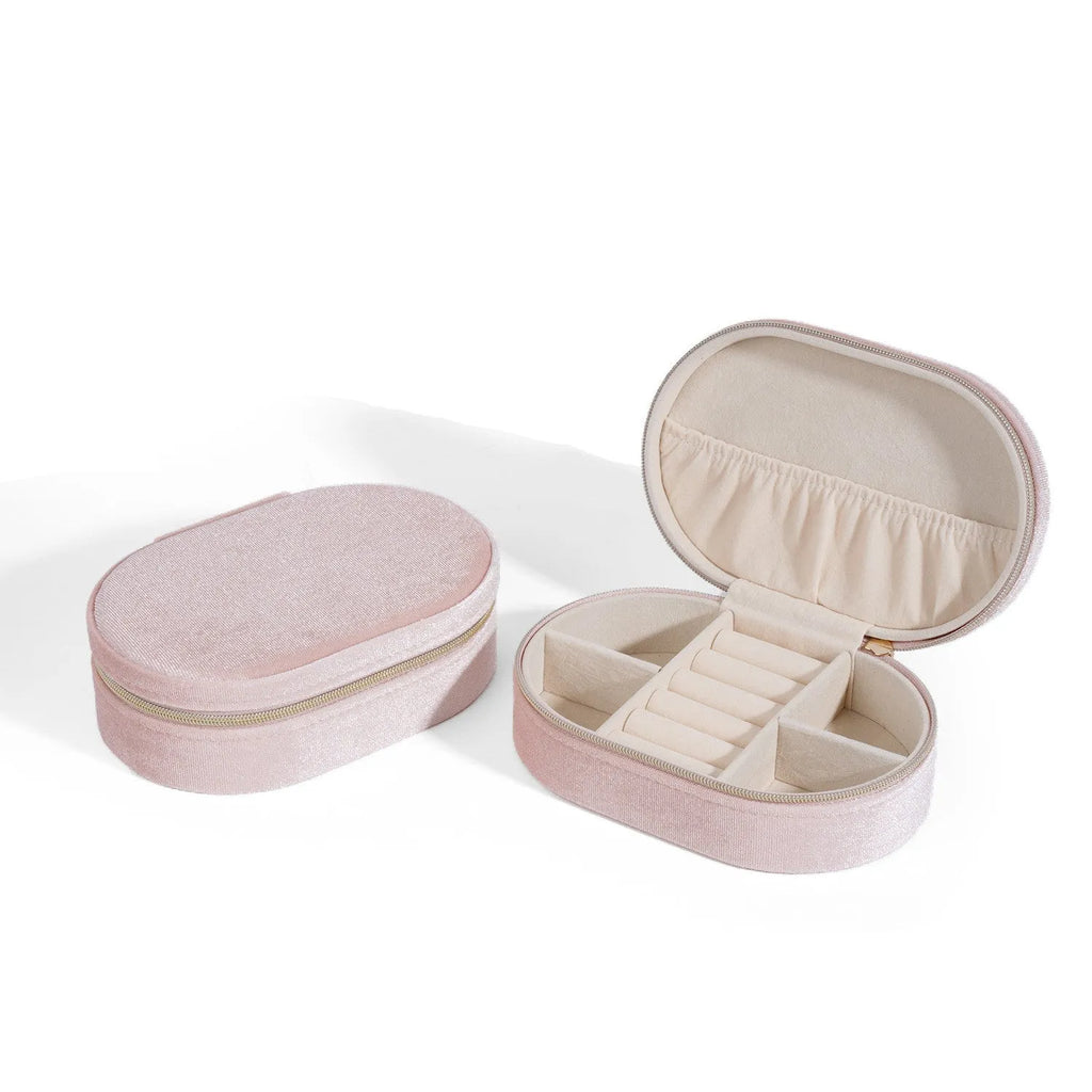 Oval velvet jewellery box in multiple colours, showing flannel interior and compact 15x10x5 cm size.