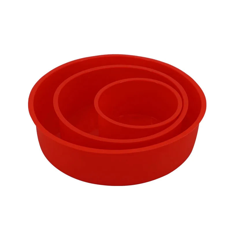 Set of three red round silicone cake baking moulds in 4-inch, 6-inch, and 8-inch sizes.
